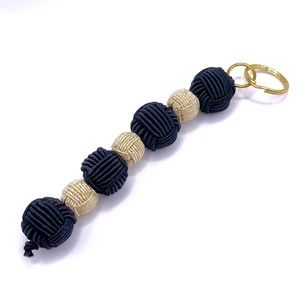 10/$10 6” wrapped beaded Keychain, black and gold w/gold hardware, NWT